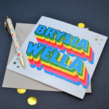 Welsh Get Well Card, Brysia Wella, Rainbow block letters, with gold foil