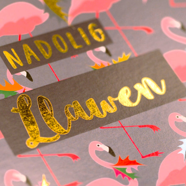 Welsh Christmas Card, Flamingoes and Holly, text foiled in shiny gold
