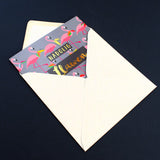 Welsh Christmas Card, Flamingoes and Holly, text foiled in shiny gold